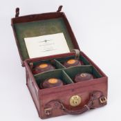 A set of wood Bowls in original leather travel case.