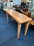 A long hardwood hall table, 148cm length, 46cm depth, 79cm height.