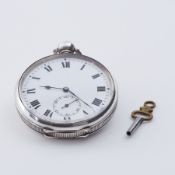 A silver pocket watch with key, total weight 99.75gm.