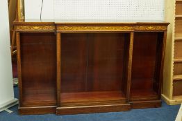 A mahogany free standing open break front bookcase with marquetry inlaid decoration and adjustable