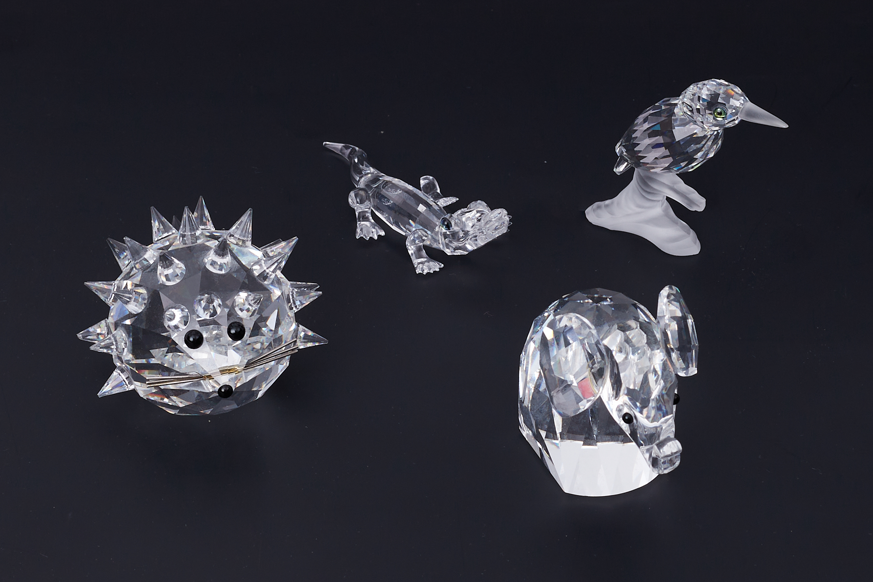 Swarovski Crystal Glass, a small collection to include Hedgehog, Elephant etc some damage (4)