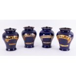 Four Bewlay's shop display tobacco jars with lids, height 22cm.