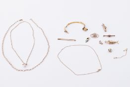 A quantity of 9ct yellow gold items including chain, brooches, charms, broken bangle, etc, 24.65gm