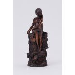 A resin/bronze model of a seated nude female by Giovanni Schoeman, height 14cm