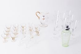 A collection of glassware including Art Deco style wine glasses, cocktail shaker, coloured glass,