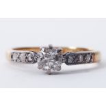 An 18ct yellow gold & platinum ring set with a round cut diamond, approx. 0.50 carats with three