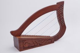 A table harp on carved wood frame, 35cm x 50cm.