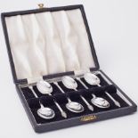 A set of six silver teaspoons with fox head finials, Sheffield, together with a set of six cased
