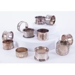 A mixed collection of eleven silver and other serviette rings (three non silver), approx 6.03oz.