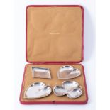 A cased set of four silver dishes, in the form of the four suits of playing cards, Birmingham