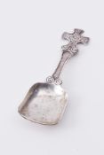 Edinburgh silver caddy spoon marked 'INVSS M & C' with a Celtic cross finial, approx 20.6g, length