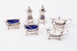 Six silver condiments comprising table salts, peppers, mustard pots, two mustard spoons and two salt