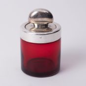 A ruby and silver mounted salt bottle, height 12cm.