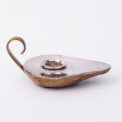 A silver mounted and brass Aladdin candle holder, marked .925.
