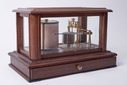A modern barograph the 'atmosphere' in mahogany inlaid case fitted with a single drawer with various