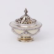 A Geo V silver circular box with pierced cover, gilt lined, circa 1912, by Elkington & Co, approx