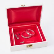 A mixed lot of silver jewellery to include two silver bangles, a silver locket, silver chain &