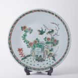 A Chinese porcelain wall plate decorated with flowers and birds with a geometric border, 37cm.