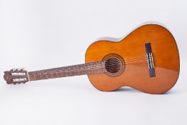A Yamaha 6225A six string acoustic guitar, cased (lacks one string).