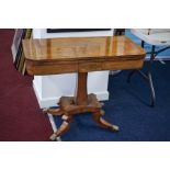 Early 19th century mahogany pedestal fold over card table, with brass inlay decoration, 91cm.