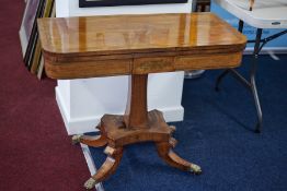 Early 19th century mahogany pedestal fold over card table, with brass inlay decoration, 91cm.