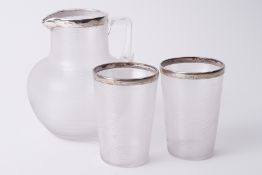 Victorian silver mounted and ribbed glass jug together with two similar beakers.