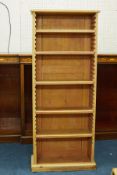 A pine bookshelf with five shelves, height 157cm, width 65cm.