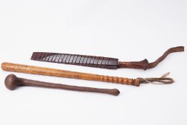 A long turned wood truncheon, length 61cm together with a long blade eastern cutting knife length