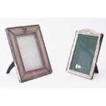 A silver and ribbon decorated rectangular photo frame with Griffin mount, 25cm x 20cm together