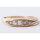 An 18ct yellow gold five stone ring set with old round cut diamonds, approx. 0.14 carats, 2.45g,