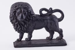 A cast iron door stop in form of a standing lion, height 22cm.