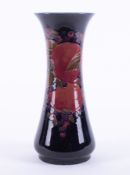 A William Moorcroft Burslem vase decorated with Pomegranate, also decorated on the inside, circa