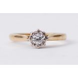An 18ct yellow gold single stone ring set with a round cut diamond in an illusion setting, approx.