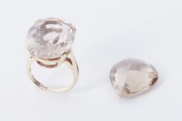A 14k yellow gold cocktail ring set with a large oval cut smokey quartz?, ring stamped 'Scalle 14k',