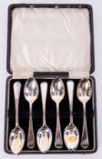 A cased set of six silver teaspoons Old English with bead pattern..