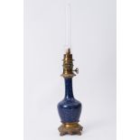 A blue bottle vase converted to a table lamp,(electric), possibly Chinese, height excluding funnel
