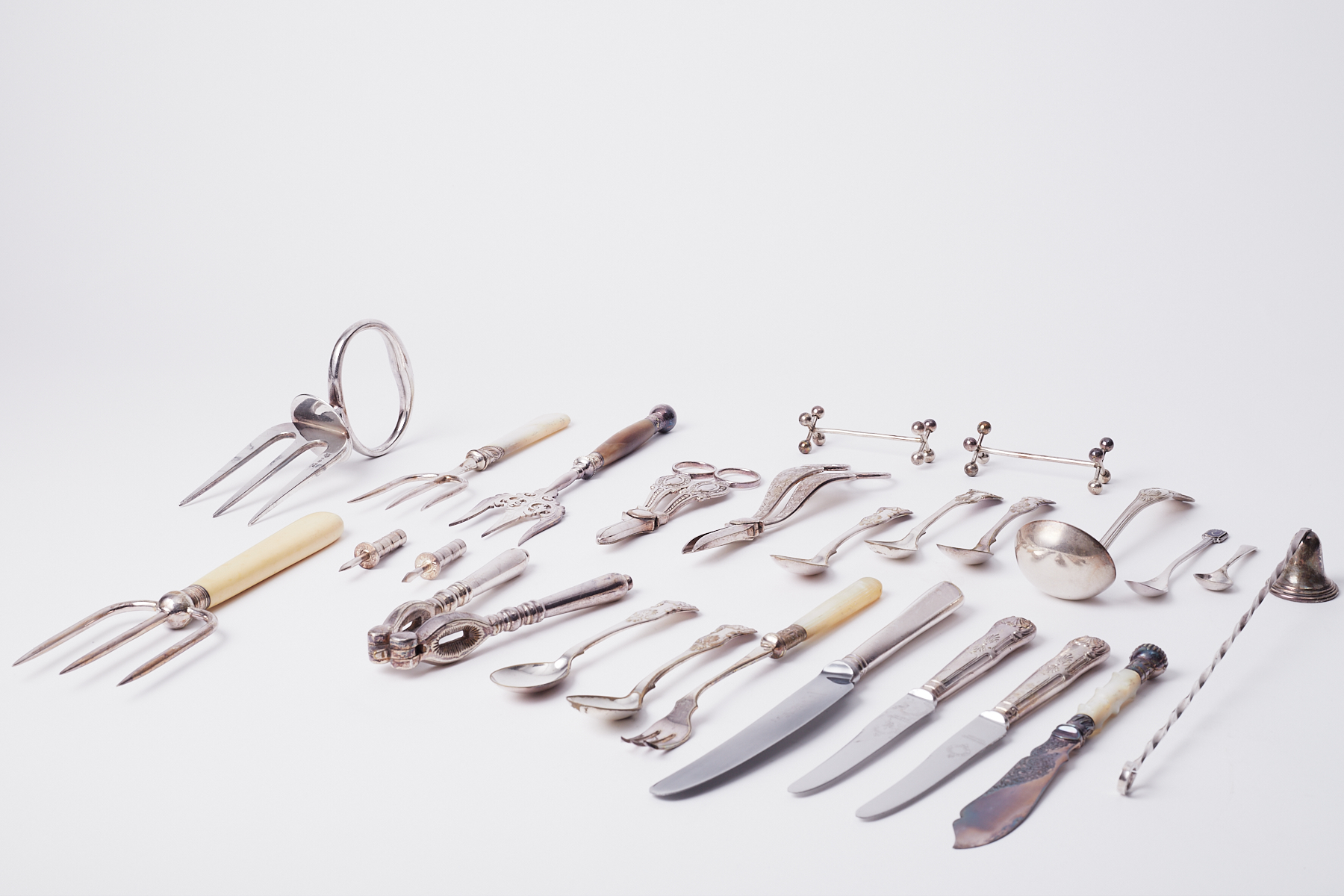 A mixed collection of silver plated cutlery and objects.