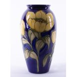 A Moorcroft vase decorated with yellow tulips, No.41/50 edition, height 25cm.