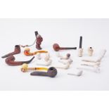 A collection of various carved meerschaum & other pipes and also a novelty carved wood Bavarian