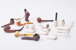 A collection of various carved meerschaum & other pipes and also a novelty carved wood Bavarian