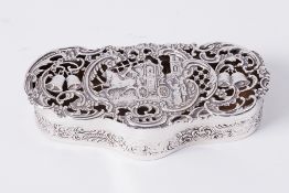 An Edwardian silver box by William Comyns, London 1903/04, of shaped form, the pierced hinged