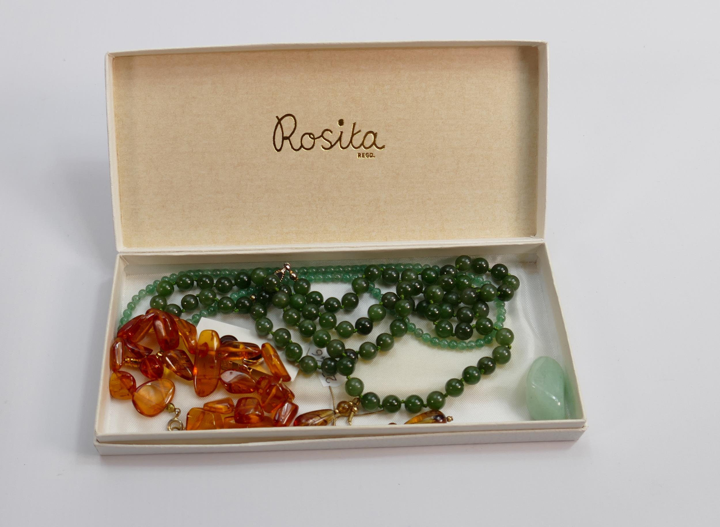 A collection of ladies costume jewellery: including Amber bracelet & earrings etc