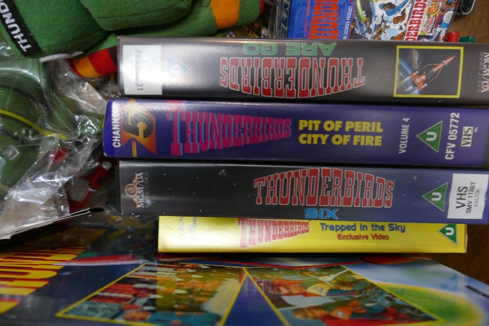 A collection of Thunderbirds related items: to include soft toys, annuals, videos, wallets, Ariel - Bild 4 aus 9