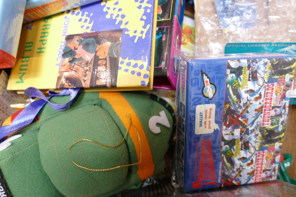 A collection of Thunderbirds related items: to include soft toys, annuals, videos, wallets, Ariel - Bild 8 aus 9