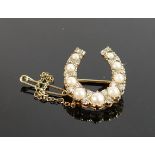 9ct gold horseshoe shaped brooch set cultured pearls and diamonds: Gross weight 4.2g, set 20