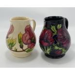 Two Walter Moorcroft Jugs - Anemone & Magnolia designs. Both H15cm.