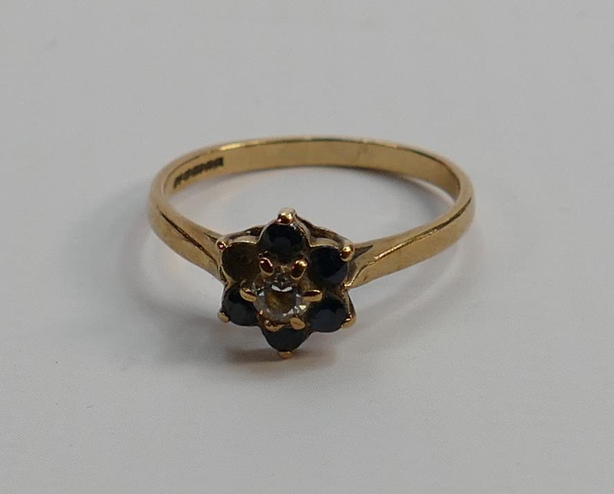 9ct gold ladies ring, 2g: one blue stone missing.