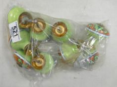 A set of colourfully decorated enamelled draw knobs (9):
