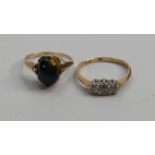 Two 9ct gold ladies rings: one set with diamonds and the other with polished stone, 3.9g.