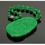 Carved Jade large oval pendant & necklace: Carved with a wild horse, with bead necklace.